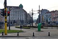 View of Lion`s Bridge from 1889 with lion sculptures, ancient buildings, intersection and traffic lights