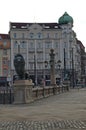 View of Lion`s Bridge from 1889 with lion sculptures, ancient buildings, intersection and traffic lights