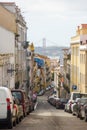 A view of Lisbon`s downtown cityscape with the Tagus river and the bridge `25 de abril` in the background Royalty Free Stock Photo