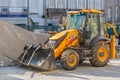 View of a loader tractor standing next to a pile of earth at the construction site Royalty Free Stock Photo