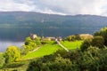 View of Loch Ness and ruined Urquhart castle in Scotland