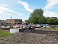 A view of the lock gates at the entrance to brighouse basin and moorings on the calder and hebble navigation canal in calderdale Royalty Free Stock Photo