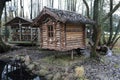 View of log cabin near pond