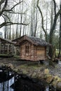 View of log cabin near pond