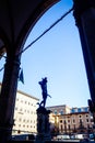 View of Loggia dei Lanzi wiht bronze statue of Perseus holding the head of Medusa by Benvenuto Cellini in Piazza della Signoria Royalty Free Stock Photo