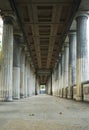 View of the long alley of a historical building with columns Royalty Free Stock Photo