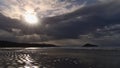 View of Long Beach in the morning with sun breaking through the clouds near Tofino on Vancouver Island, Canada with rough sea. Royalty Free Stock Photo