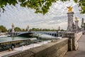 View looking across the ornate Alexander III bridge towards the Grand Palais in Paris