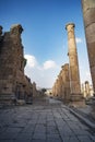 A view looking down the Cardo showing stone carved columns and paved street at the ancient city of Jarash or Gerasa, Jerash in