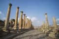 A view looking down the Cardo showing stone carved columns and paved street at the ancient city of Jarash or Gerasa, Jerash in