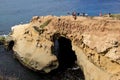 View looking over the cliffs on La Jolla Beach, with sightseers enjoying the weather, San Diego, California, 2016