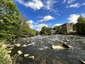 The River Aire, as it flows past, Hirst Wood, Shipley, Yorkshire, UK