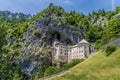 A view looking up at the medieval castle built into the cliff face at Predjama, Slovenia Royalty Free Stock Photo