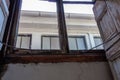 View looking up out of a clerestory window, heavy water damage evident