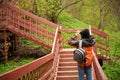 a view, looking up for the top of a long wooden staircase located in a forest. Part of a hiking trail and used to connect Royalty Free Stock Photo