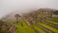 View of the Lost Incan City of Machu Picchu inside de fog, near Cusco, Peru Royalty Free Stock Photo