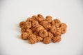 View a lot of insulated tigernuts on a white background. The Spanish tigernut is called chufa