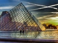 Louvre and Glass piramid in evening light. Paris France. Royalty Free Stock Photo