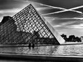 Louvre and Glass piramid in evening light. Paris in B&W.. Royalty Free Stock Photo