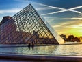 Louvre and Glass piramid during sunset. Paris France. Royalty Free Stock Photo