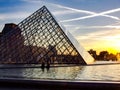 Louvre and glass piramid during sunset Royalty Free Stock Photo