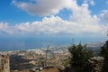 View of the lower level of the castle of Saint Hilarion, the city of Kyrenia, mountains, fluffy clouds and the Mediterranean sea Royalty Free Stock Photo