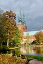 View of Lubeck Cathedral from Muhlenteich Mill pond in autumn,