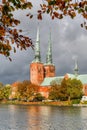 View of Lubeck Cathedral from Muhlenteich Mill pond in autumn, Germany. Royalty Free Stock Photo