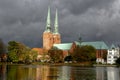 View of Lubeck Cathedral from Muhlenteich Mill pond in autumn, Royalty Free Stock Photo