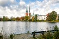 View of Lubeck The white swan is swimming in the lake. Cathedral Royalty Free Stock Photo