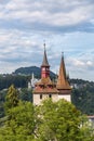 Spire tower on the background of the castle standing on a mountain in Lucerne, Switzerland