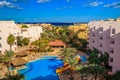 View of the luxurious hotel with swimming pool and Red sea Royalty Free Stock Photo