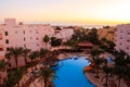 View of the luxurious hotel with swimming pool and Red sea at sunrise Royalty Free Stock Photo