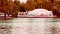 View of the luxurious white tent and gazebo for ceremonies and celebrations on the shore pier on a summer evening