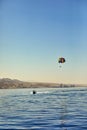 The view from the luxury yacht to the open red sea with the attraction flying on a parachute tied to a boat Royalty Free Stock Photo