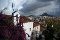 View of Lycabettus hill and city under the clouds from Anafiotika neighborhood in the old town of Athens, Greece Royalty Free Stock Photo