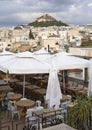 View of Lykavitos hill in from a cafe in Plaka the city of Athens, Greece Royalty Free Stock Photo