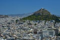 A view of Lykavittos Hill from the Areopagus Hill in Athens, Greece