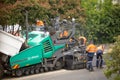 View of machinery and workers laying new bitumen on a suburban road near Hobart Royalty Free Stock Photo