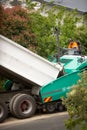 View of machinery and workers laying new bitumen on a suburban road near Hobart Royalty Free Stock Photo