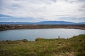 View made over the lake in the former Kremikovtsi mine and views of Sofia and Vitosha Mountain. Royalty Free Stock Photo