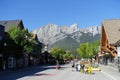 A view of the main street with the mountains in the background during a beautiful summer day in Canmore, Alberta, Canada.