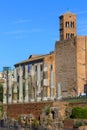 View of the main street of the Roman Forum Via Sacra, remains of columns and bell tower of Santa Francesca Romana Basilica, Rome,