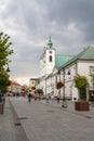 View of the 3 Maja Street in downtown Rzeszow with ist many restaurants and shops and the historic Catholic Church