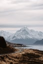 View of the majestic Aoraki Mount Cook with the road leading to Mount Cook Village. Taken during winter in New Zealand. Royalty Free Stock Photo