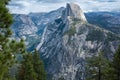 A view of the majestic Half Dome and the valley below from a viewpoint on the Glacier Point Hike trial. Royalty Free Stock Photo