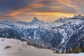 Majestic snow covered mountain range against cloudy sky during sunset in alps Royalty Free Stock Photo