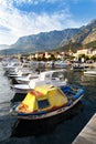 View of Makarska harbour with boats and blue sky.