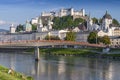 View of Makartsteg bridge over Salzach River and Hohensalzburg Castle above the Salzburg Old City, Austria.