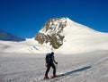 Male backcountry skier on his way to the Rimpfischhorn peak in the Alps of Switzerland near Zermatt